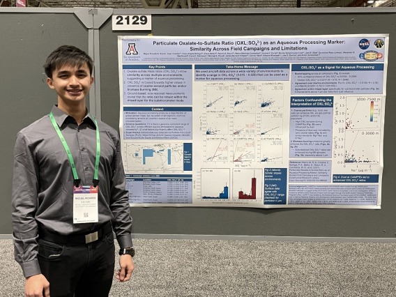 Miguel Hilario with Research Poster