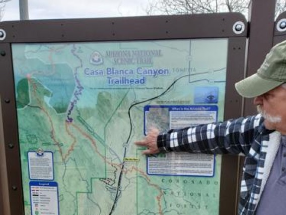 Bob Proctor, board member with the Mountain Empire Trail Association and the Cienega Watershed Partnership, points to location of proposed trail in honor of Tom Meixner