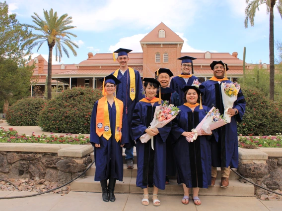 Xubin Zenb with his 2025 graduates near Old Main