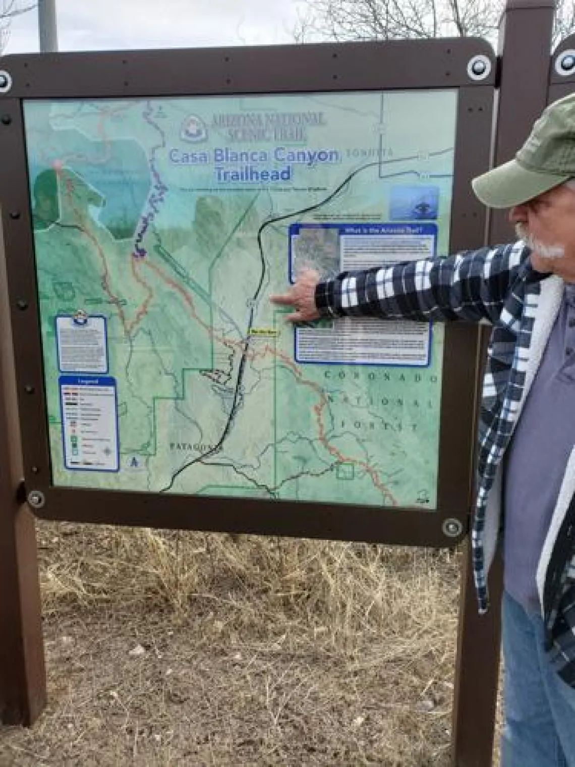 Bob Proctor, board member with the Mountain Empire Trail Association and the Cienega Watershed Partnership, points to location of proposed trail in honor of Tom Meixner