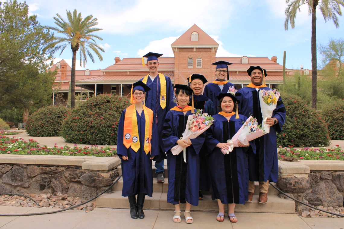 Xubin Zenb with his 2025 graduates near Old Main