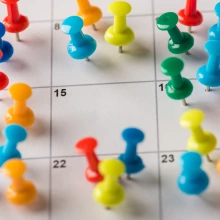 Calendar with Push Pins Meeting Reminder